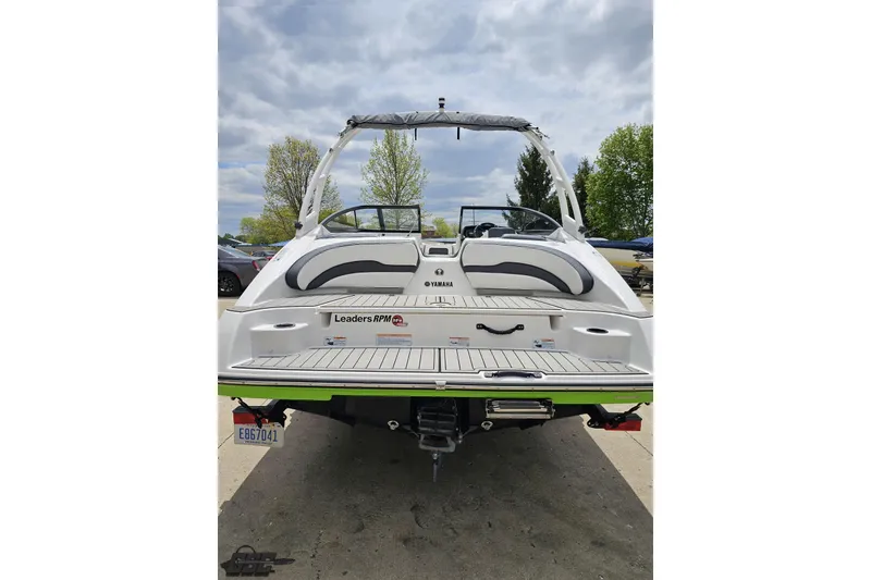 Slide: The Image of 2022 Yamaha Boats AR195, rear view, showcasing sleek design and spacious deck. - 33