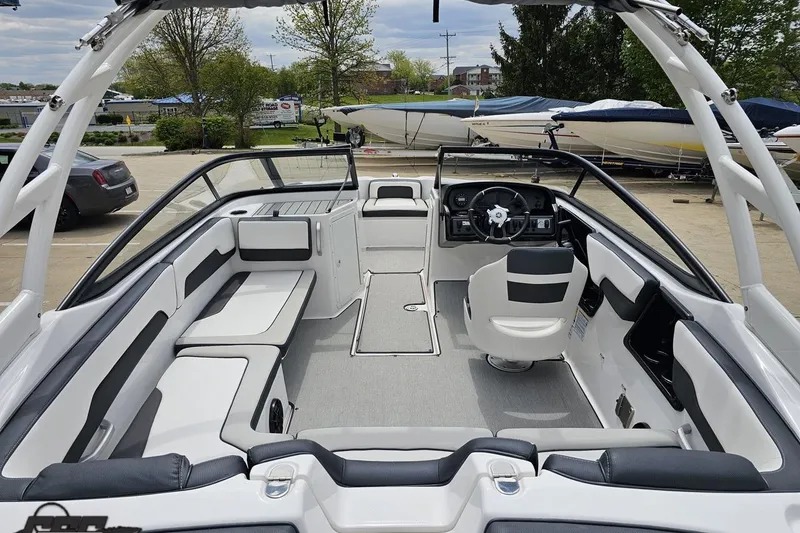 Slide: The Image of 2022 Yamaha Boats AR195 interior with sleek seating and modern dashboard design. - 40