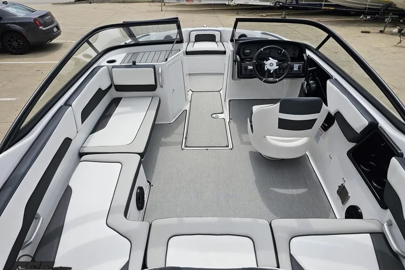 Slide: The Image of 2022 Yamaha Boats AR195 interior with sleek seating and modern dashboard design. - 41