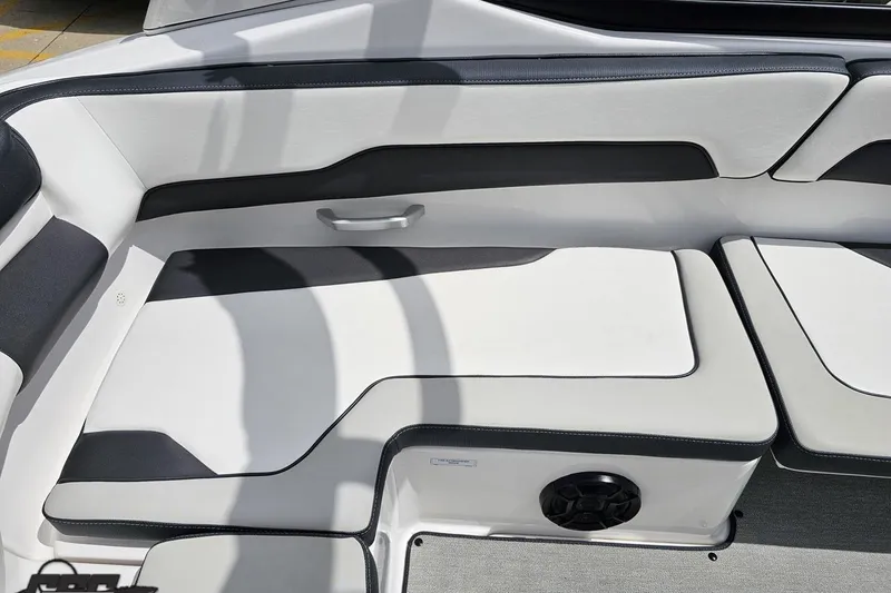 Slide: The Image of 2022 Yamaha Boats AR195 interior seating with sleek white and black upholstery design. - 43