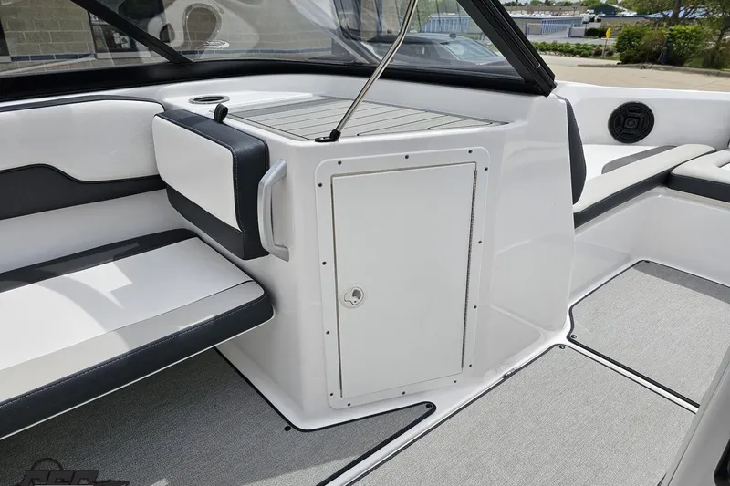 Slide: The Image of Interior view of a 2022 Yamaha Boats AR195, featuring sleek seating and storage. - 49
