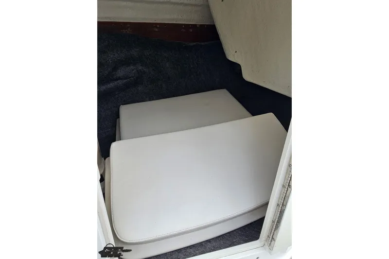 Slide: The Image of Storage compartment with cushions in a 2022 Yamaha AR195 boat. - 50