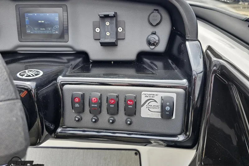 Slide: The Image of Control panel of 2022 Yamaha Boats AR195 with switches and display screen. - 62