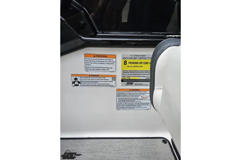 Slide: The Image of 2022 Yamaha Boats AR195 capacity warning labels, maximum 8 persons or 1280 lbs. - 63