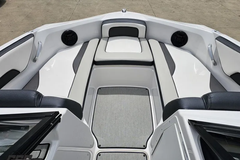 Slide: The Image of 2022 Yamaha Boats AR195 interior with cushioned seating and speakers. - 68
