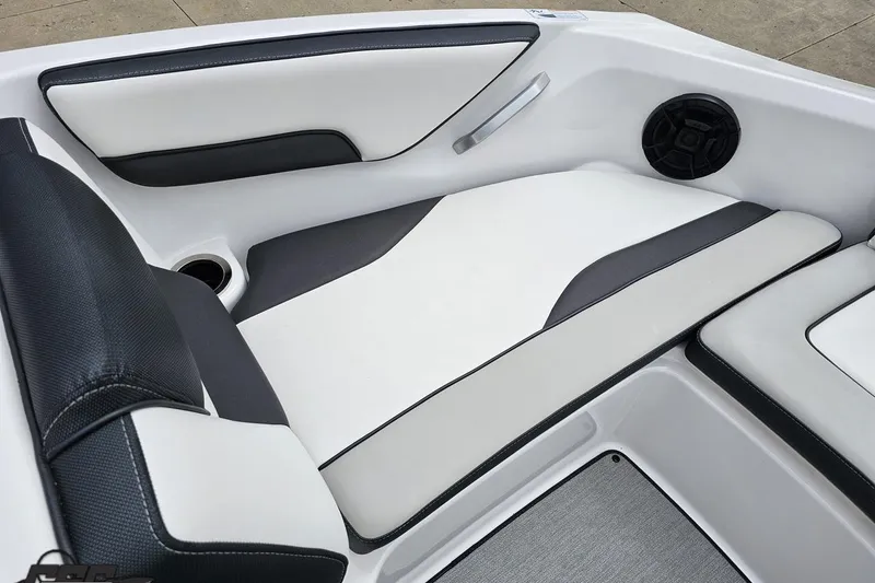 Slide: The Image of 2022 Yamaha Boats AR195 interior seating with sleek black and white design. - 73