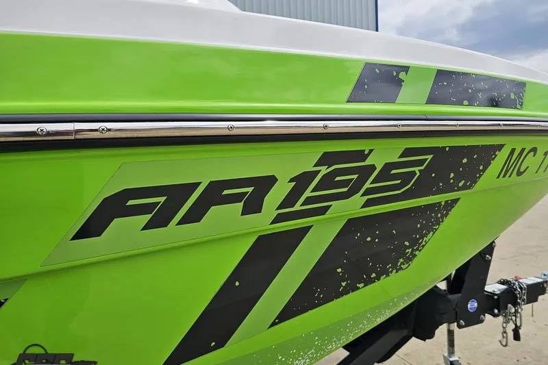 Slide: The Image of 2022 Yamaha AR195 boat with vibrant green and black graphics. - 8