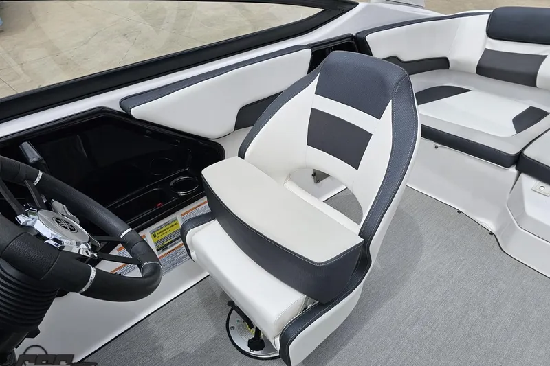 Slide: The Image of 2022 Yamaha Boats AR195 interior with sleek steering wheel and comfortable seating. - 80
