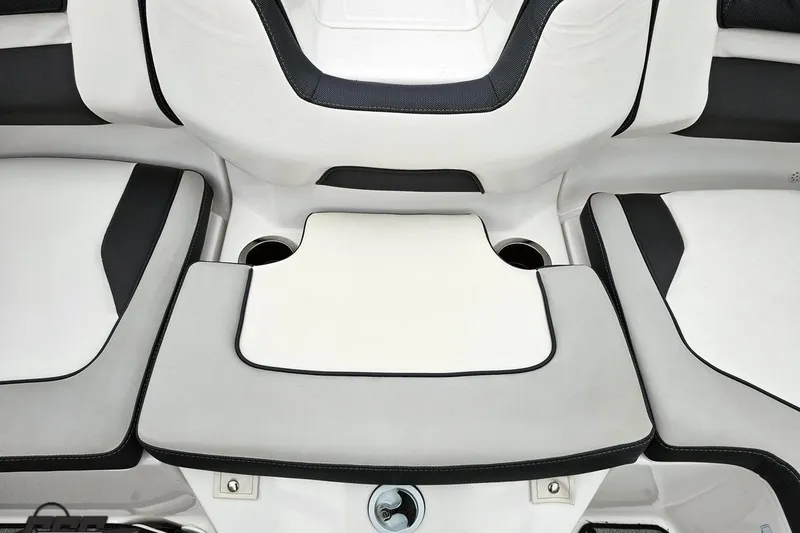 Slide: The Image of 2022 Yamaha Boats AR195 interior seating with cup holders and sleek design. - 84