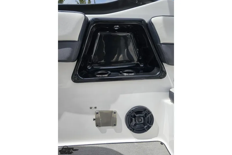 Slide: The Image of Interior detail of 2022 Yamaha Boats AR195, featuring speaker and storage compartment. - 87