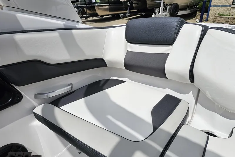 Slide: The Image of 2022 Yamaha AR195 boat interior with sleek white and black seating. - 88