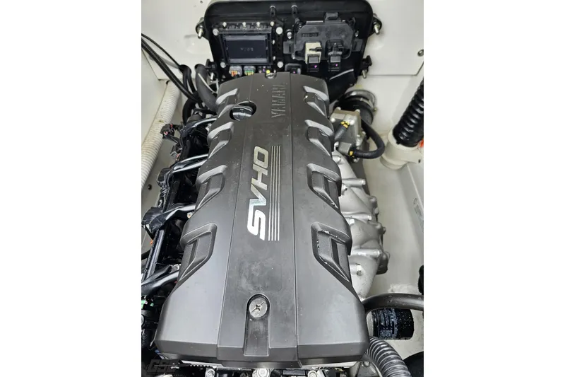 Slide: The Image of 2022 Yamaha Boats AR195 engine compartment with SVHO engine cover. - 96