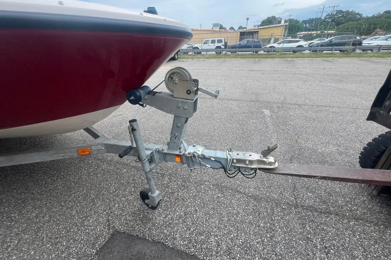 Slide: The Image of 2015 Bayliner Element XL boat trailer hitch in parking lot. - 12