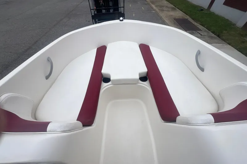 Slide: The Image of 2015 Bayliner Element XL boat interior with white and red seating. - 15