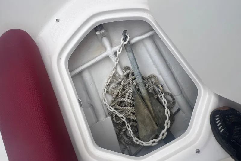 Slide: The Image of Anchor and rope storage in 2015 Bayliner Element XL boat compartment. - 16