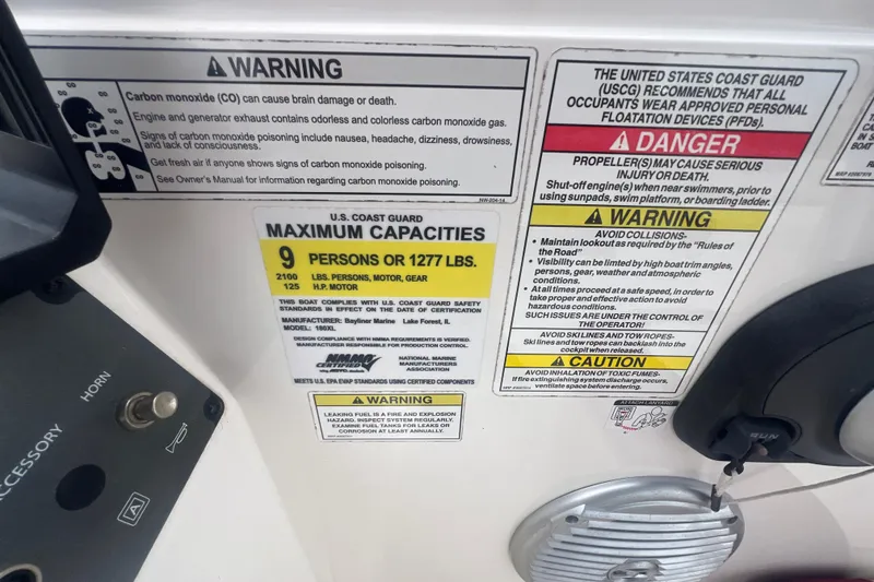 Slide: The Image of 2015 Bayliner Element XL safety and capacity warnings, including carbon monoxide and maximum load limits. - 18