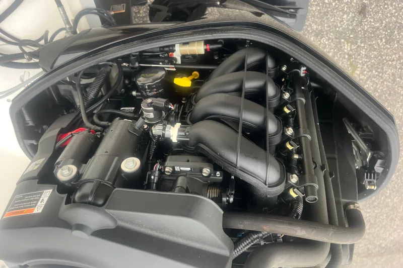 Slide: The Image of 2015 Bayliner Element XL engine compartment, showcasing detailed mechanical components. - 25