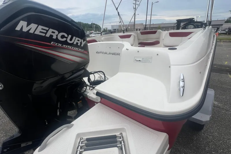 Slide: The Image of 2015 Bayliner Element XL boat with Mercury FourStroke engine, parked outdoors. - 6