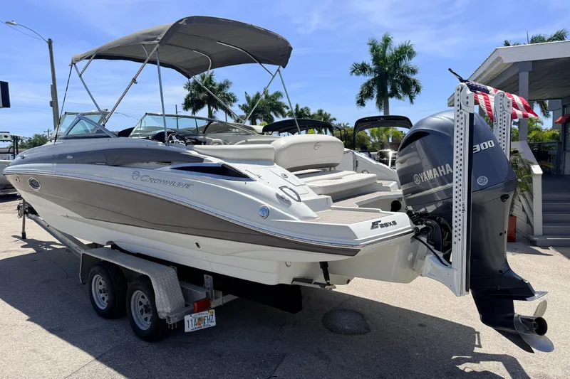 Slide: The Image of 2018 Crownline Eclipse E26 XS boat with Yamaha 300 engine on trailer. - 10