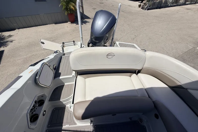 Slide: The Image of 2018 Crownline Eclipse E26 XS boat interior with seating and outboard motor. - 12