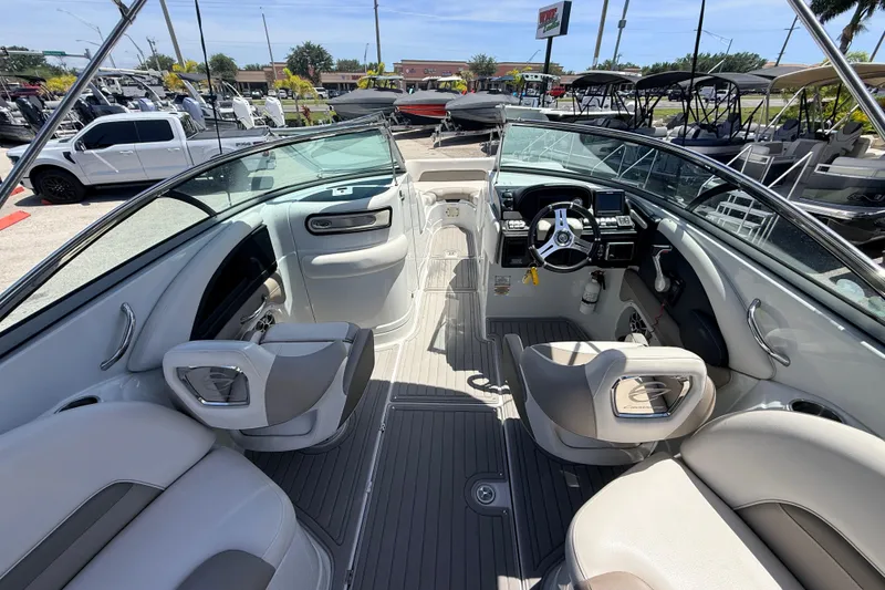 Slide: The Image of 2018 Crownline Eclipse E26 XS boat interior with modern seating and steering console. - 13