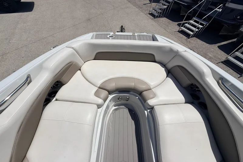 Slide: The Image of 2018 Crownline Eclipse E26 XS boat interior with spacious seating and cup holders. - 15