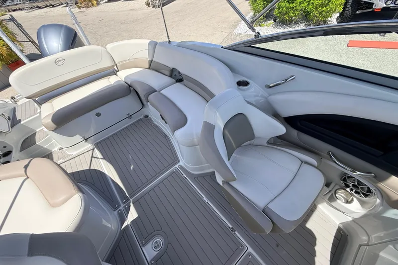 Slide: The Image of 2018 Crownline Eclipse E26 XS boat interior with plush seating and modern design. - 18