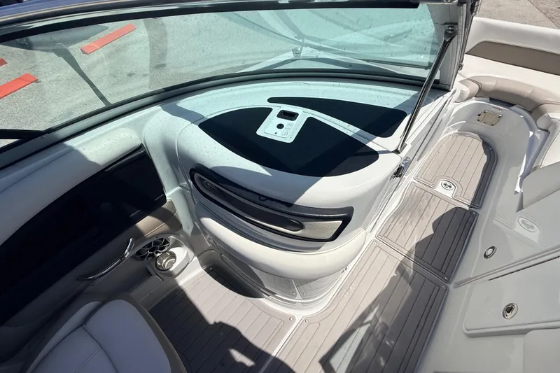 Slide: The Image of 2018 Crownline Eclipse E26 XS boat interior with sleek seating and modern dashboard design. - 19