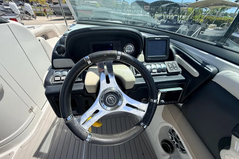 Slide: The Image of Steering console of 2018 Crownline Eclipse E26 XS boat with modern controls and navigation system. - 23