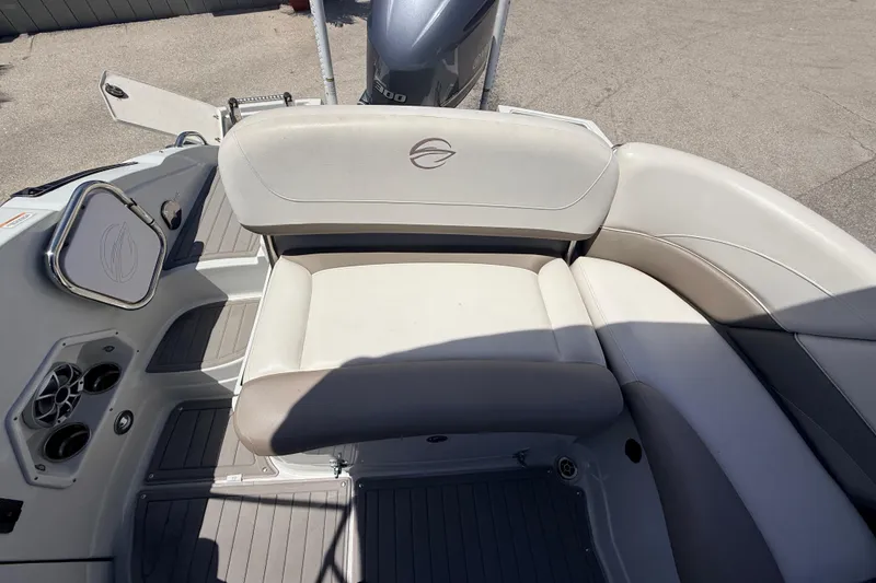 Slide: The Image of 2018 Crownline Eclipse E26 XS boat interior with cushioned seating and sleek design. - 25
