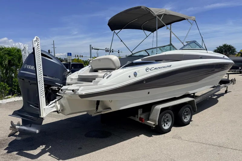 Slide: The Image of 2018 Crownline Eclipse E26 XS boat on trailer with Yamaha outboard motor. - 6