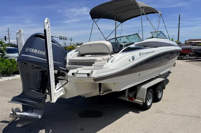 Slide: The Image of 2018 Crownline Eclipse E26 XS boat with Yamaha outboard engine on trailer. - 7