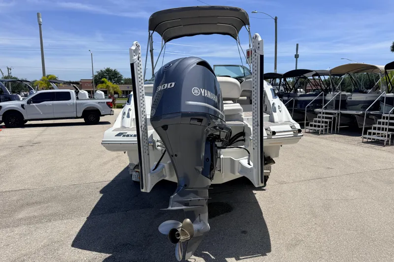 Slide: The Image of 2018 Crownline Eclipse E26 XS boat with Yamaha 300 outboard motor in a marina. - 8