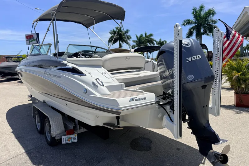 Slide: The Image of 2018 Crownline Eclipse E26 XS boat with Yamaha 300 engine on trailer. - 9