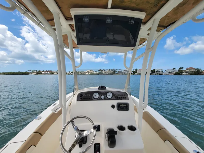 Slide: The Image of Interior view of a 2016 Pioneer 197 Islander boat on calm waters. - 3
