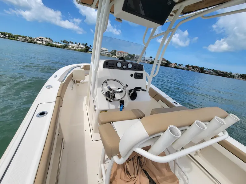 Slide: The Image of Interior view of a 2016 Pioneer 197 Islander boat on the water. - 4