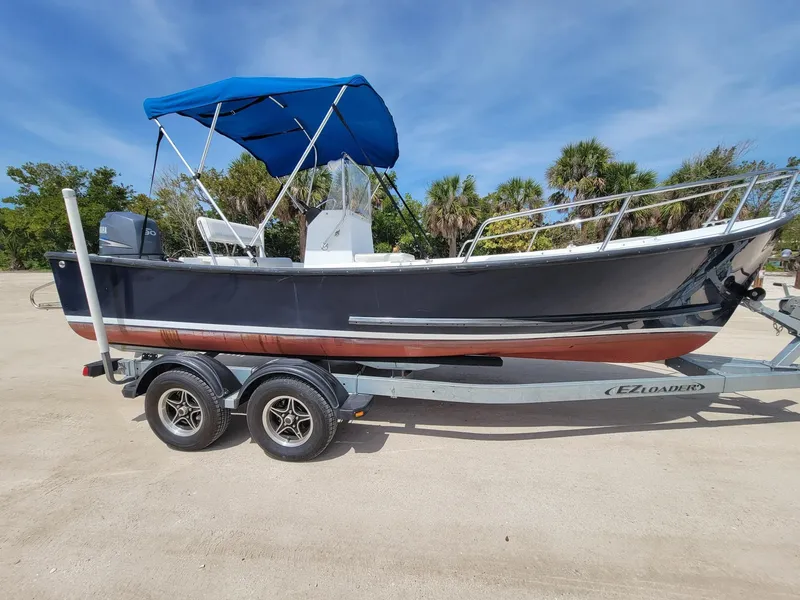 The Image of 2007 Eastern 20CC boat on trailer with blue canopy. - 1