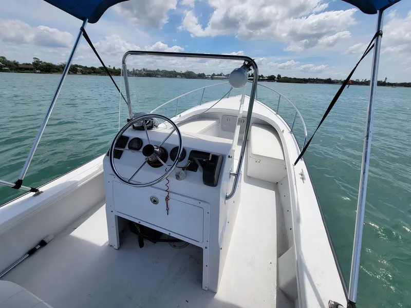 Slide: The Image of 2007 Eastern 20CC boat on calm water under blue sky. - 3
