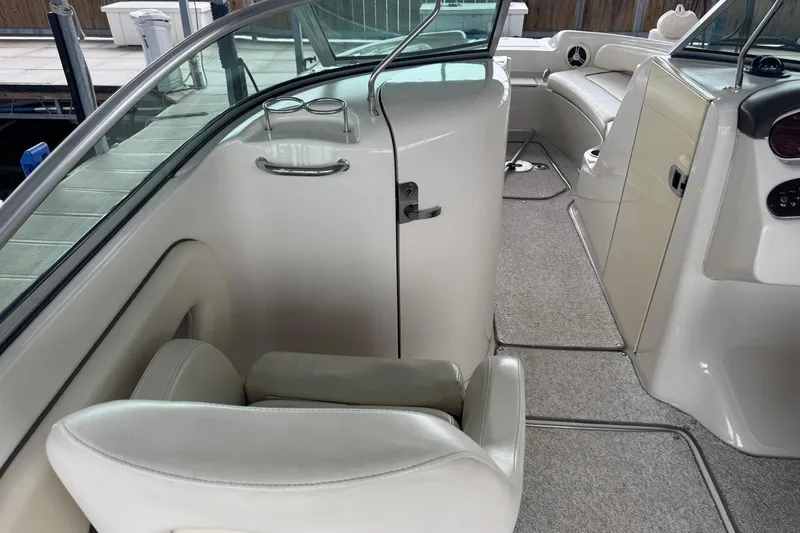 Slide: The Image of Interior of 2008 Sea Ray 240 Sundeck boat with seating and dashboard view. - 13