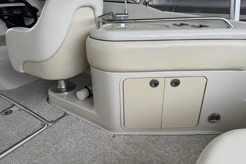 Slide: The Image of Interior of 2008 Sea Ray 240 Sundeck boat, featuring seating and storage compartments. - 22