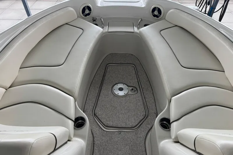 Slide: The Image of Interior view of 2008 Sea Ray 240 Sundeck boat with cushioned seating and carpeted floor. - 24