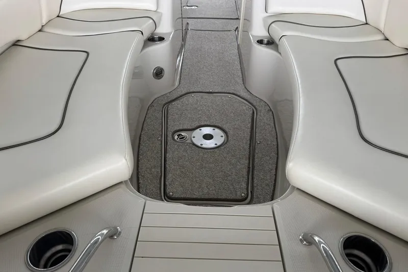 Slide: The Image of Interior view of a 2008 Sea Ray 240 Sundeck boat with cushioned seating. - 25
