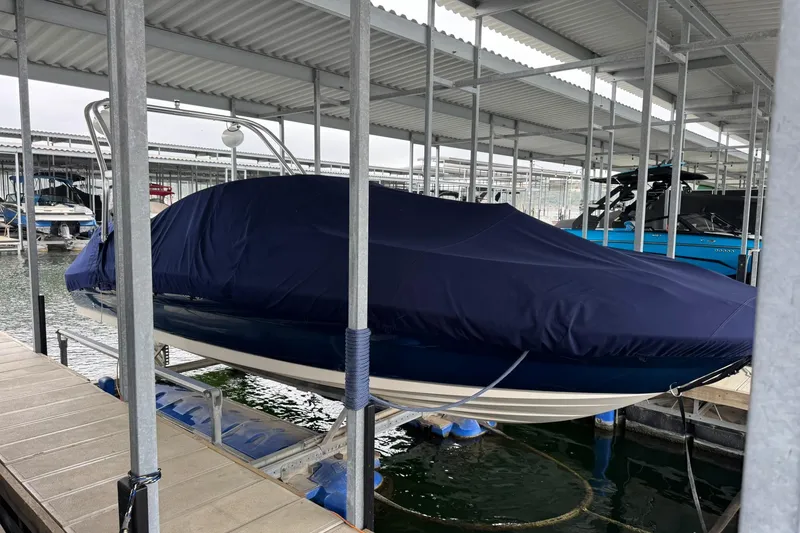 Slide: The Image of Covered 2008 Sea Ray 240 Sundeck boat docked in a marina. - 3
