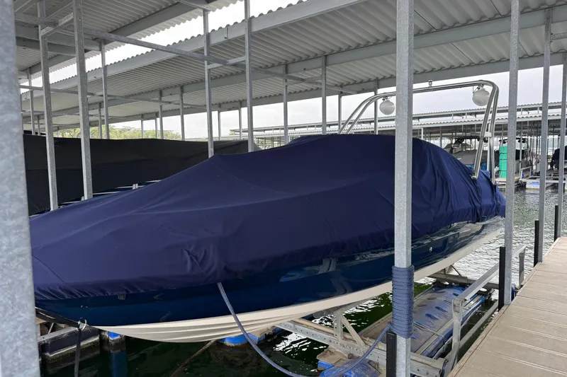 Slide: The Image of Covered 2008 Sea Ray 240 Sundeck boat docked in a sheltered marina. - 4