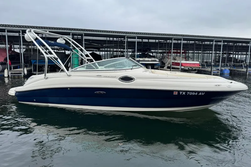 Slide: The Image of 2008 Sea Ray 240 Sundeck boat docked in marina, side view. - 8