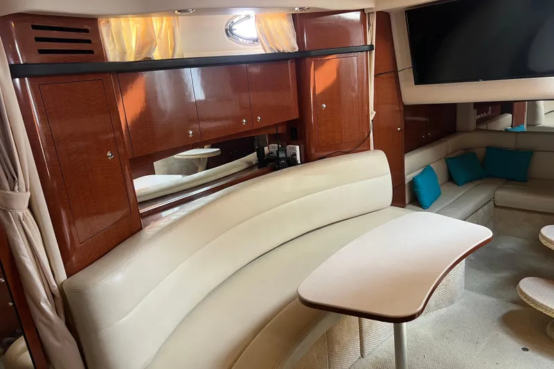 Slide: The Image of Luxurious interior of a 2003 Sea Ray 340 Sundancer yacht with elegant seating and cabinetry. - 12