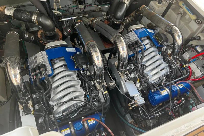 Slide: The Image of Engine compartment of a 2003 Sea Ray 340 Sundancer, showcasing dual inboard engines. - 19