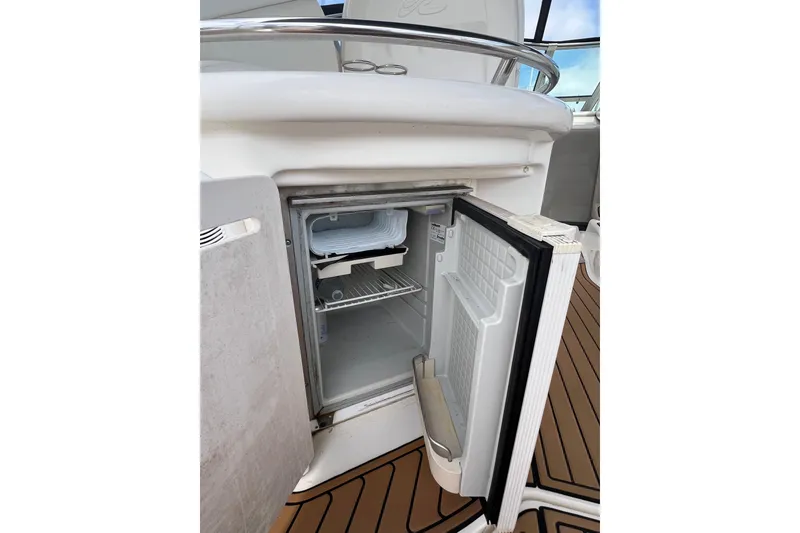 Slide: The Image of Open mini fridge on 2003 Sea Ray 340 Sundancer boat deck. - 6
