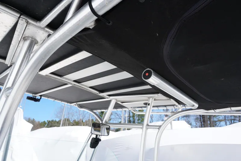 Slide: The Image of T-top structure of a 2012 Sailfish 2380 CC boat with rod holders and canopy. - 19