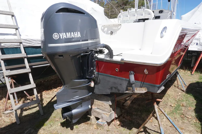 Slide: The Image of 2012 Sailfish 2380 CC boat with Yamaha outboard motor on dry dock. - 26
